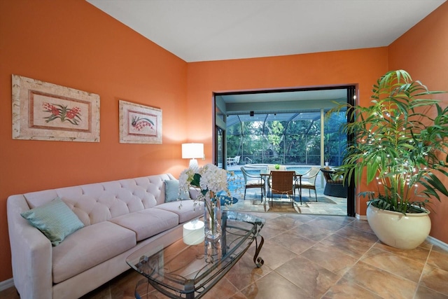 living area with baseboards and a sunroom