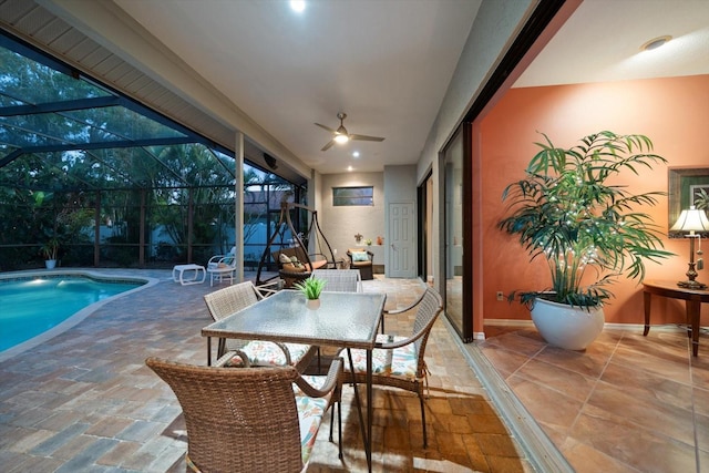 sunroom / solarium with ceiling fan