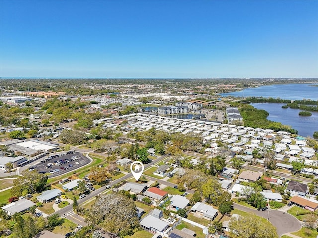 birds eye view of property with a residential view and a water view