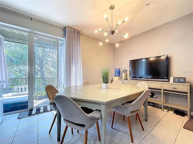 dining space featuring light tile patterned floors and a notable chandelier