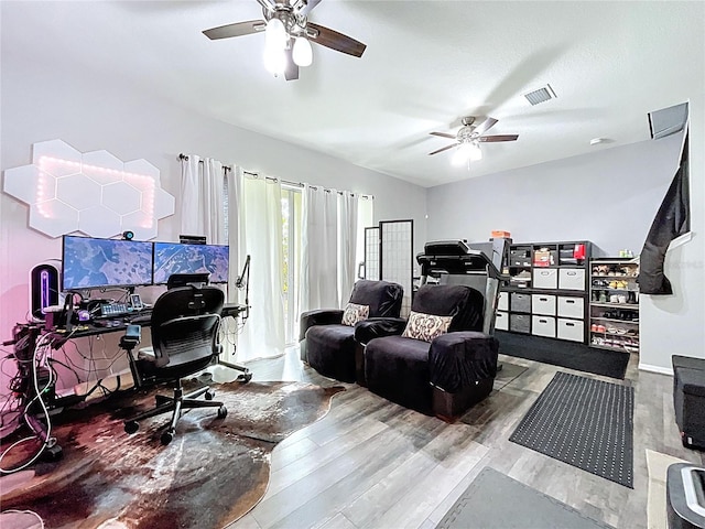 office space featuring visible vents, ceiling fan, and wood finished floors