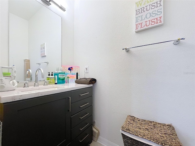 bathroom featuring vanity and baseboards