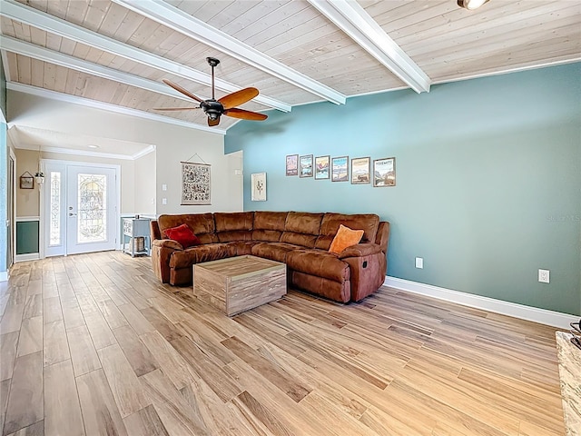 living area featuring light wood finished floors, beamed ceiling, wooden ceiling, and ceiling fan