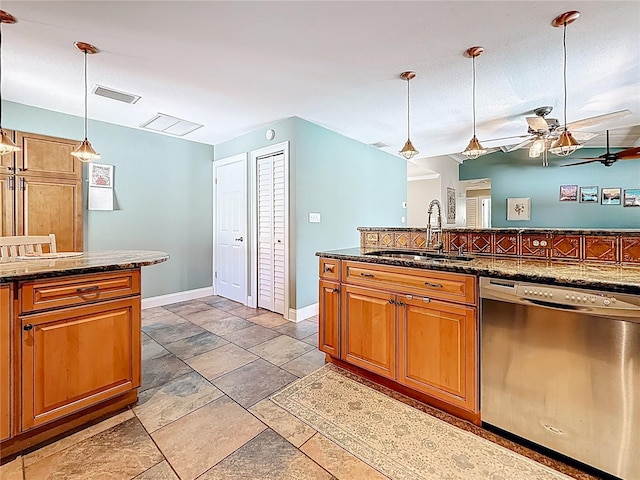 kitchen featuring visible vents, a ceiling fan, a sink, brown cabinetry, and dishwasher