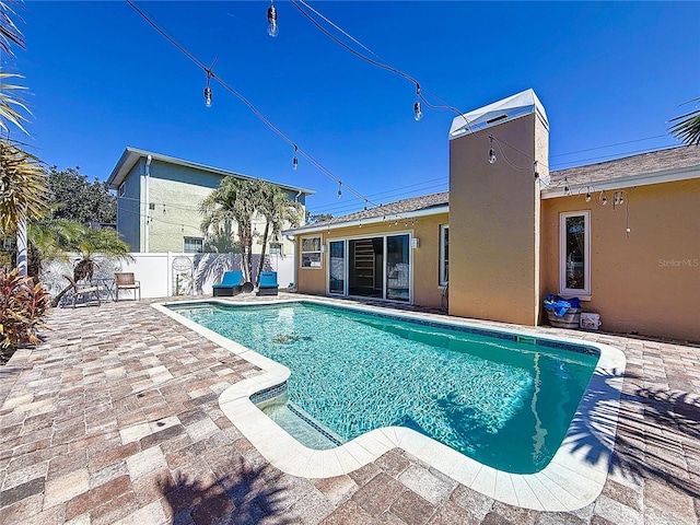 view of pool featuring a patio, fence, and a fenced in pool