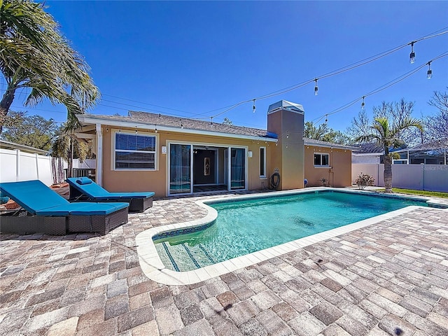 view of pool with a fenced backyard, a fenced in pool, and a patio