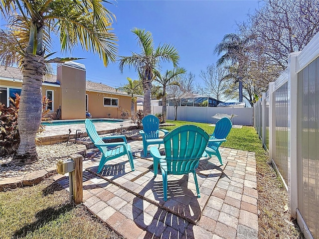 view of patio / terrace with a fenced backyard and a fenced in pool