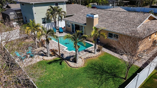 view of swimming pool with a patio area, a yard, a fenced backyard, and a fenced in pool