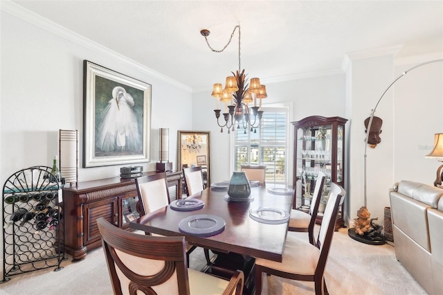 dining area with light carpet, a notable chandelier, and ornamental molding