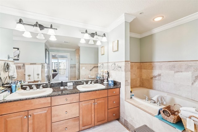 bathroom with a garden tub, ornamental molding, double vanity, and a sink