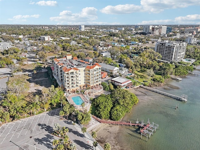 birds eye view of property featuring a water view and a city view