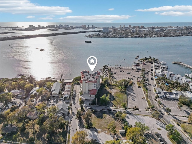 drone / aerial view featuring a view of city and a water view