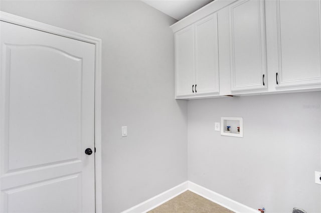 laundry area with electric dryer hookup, washer hookup, hookup for a gas dryer, cabinet space, and baseboards