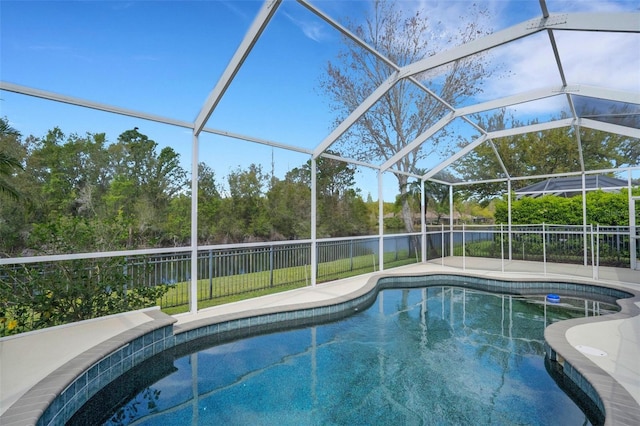 view of swimming pool with a lanai, a fenced in pool, a fenced backyard, and a water view