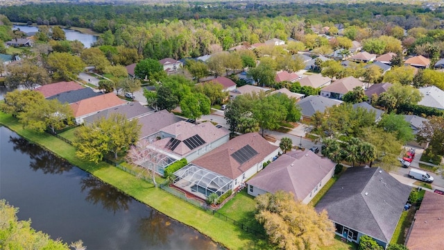 aerial view with a residential view and a water view