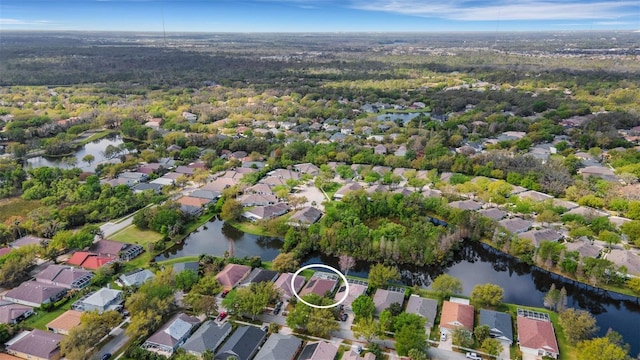 birds eye view of property with a residential view and a water view