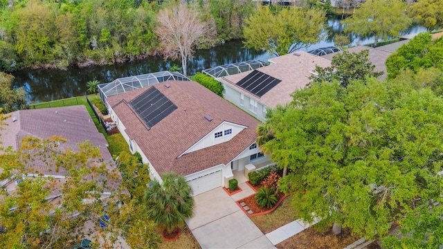 birds eye view of property with a water view