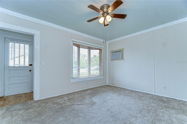 carpeted empty room featuring crown molding, a ceiling fan, and a wall mounted air conditioner