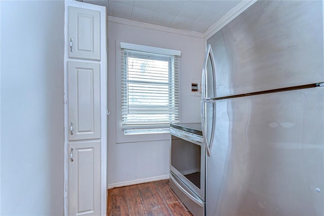 kitchen featuring crown molding, wood finished floors, baseboards, and stainless steel appliances