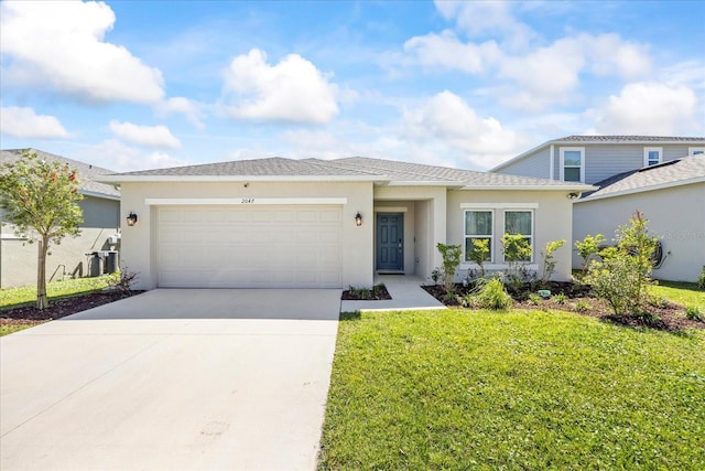 view of front of property with stucco siding, an attached garage, concrete driveway, and a front lawn