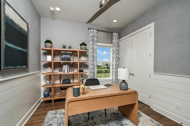 office area with dark wood-style floors, a wainscoted wall, recessed lighting, and a textured ceiling