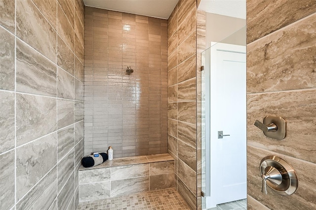 bathroom featuring a tile shower