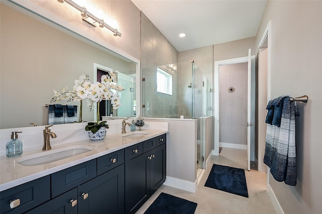 full bathroom with a sink, a stall shower, and double vanity