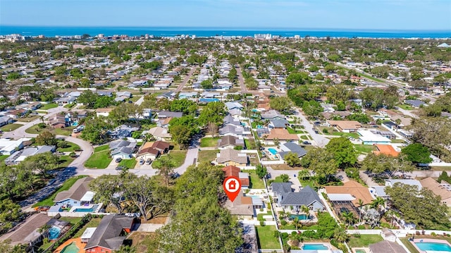 bird's eye view featuring a residential view and a water view