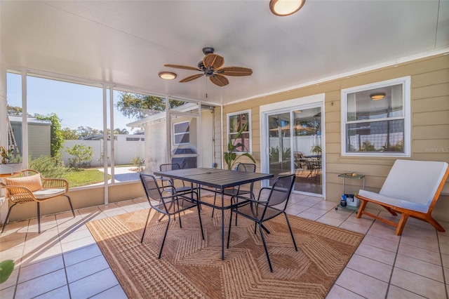 sunroom with a ceiling fan