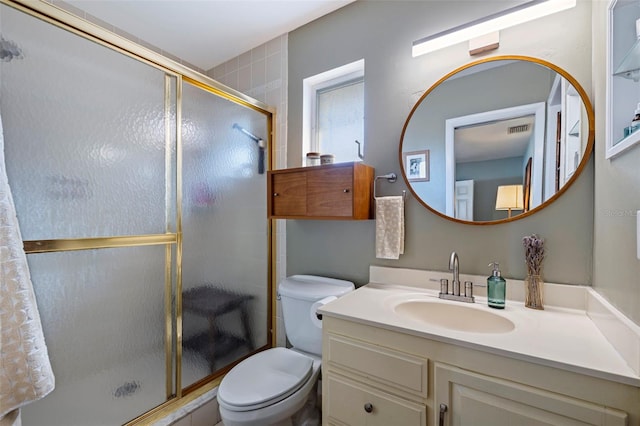 full bath featuring visible vents, vanity, toilet, and a shower stall