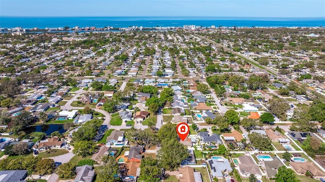 drone / aerial view featuring a water view and a residential view