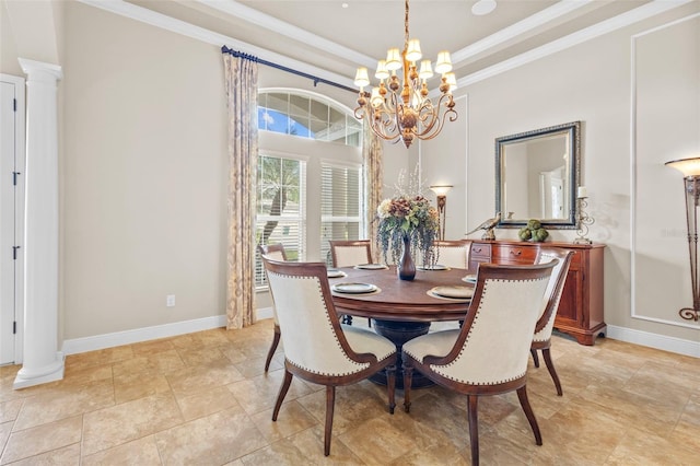 dining space featuring ornamental molding, a notable chandelier, baseboards, and decorative columns