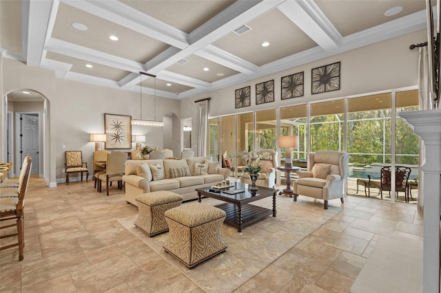 living area with arched walkways, beam ceiling, coffered ceiling, and a towering ceiling