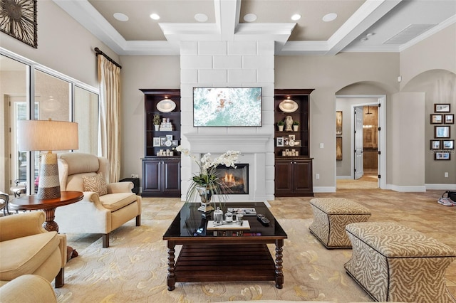 living room with beam ceiling, coffered ceiling, a large fireplace, arched walkways, and baseboards