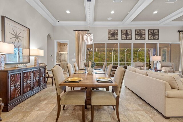 dining room featuring beamed ceiling, a healthy amount of sunlight, arched walkways, and coffered ceiling