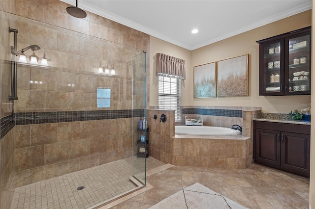 bathroom featuring a garden tub, ornamental molding, vanity, and a tile shower