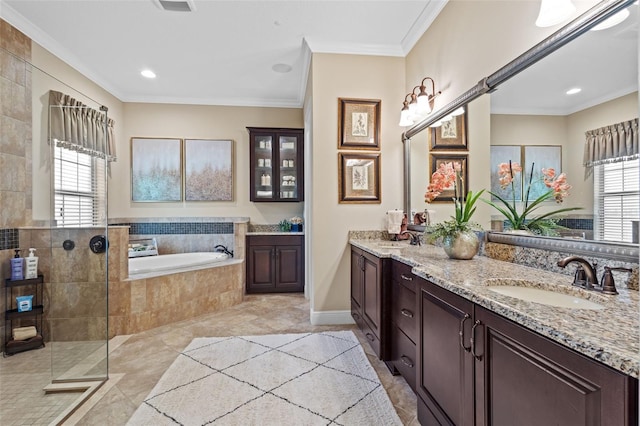 full bathroom with a garden tub, ornamental molding, double vanity, and a sink