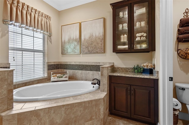 full bathroom with a garden tub and toilet