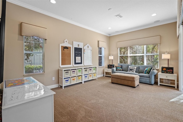 living area featuring crown molding, baseboards, and carpet floors