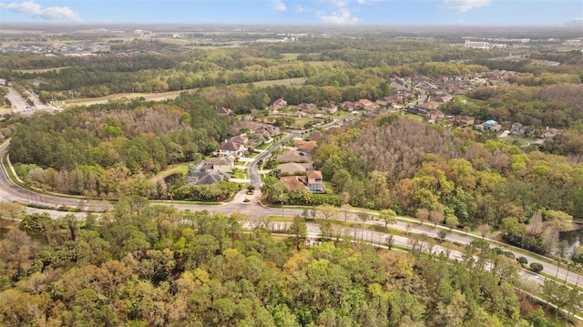 aerial view featuring a wooded view