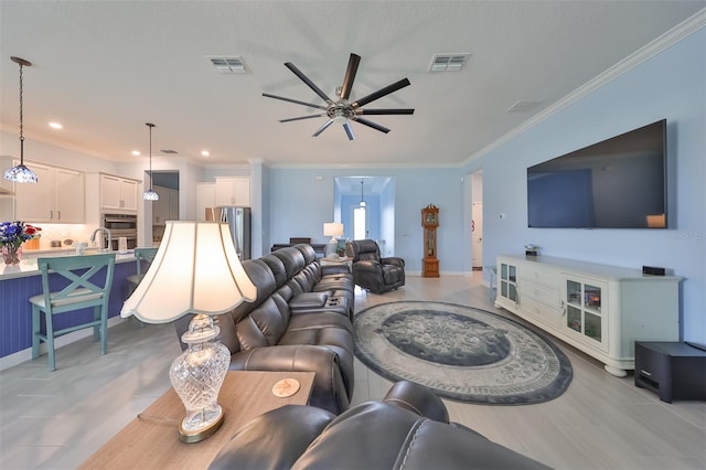 living area with recessed lighting, visible vents, ceiling fan, and crown molding