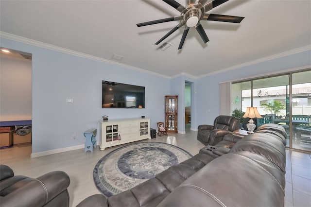 living room with visible vents, baseboards, ornamental molding, and a ceiling fan