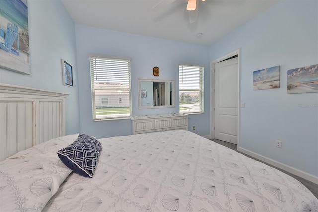 bedroom featuring baseboards and ceiling fan