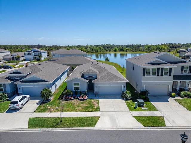 birds eye view of property featuring a residential view and a water view