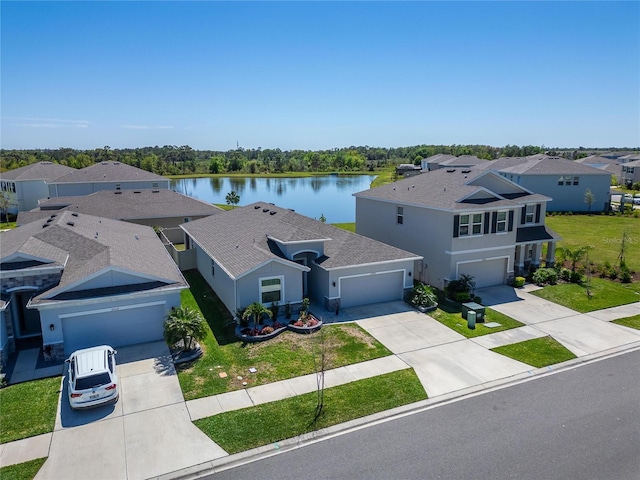 birds eye view of property with a residential view and a water view