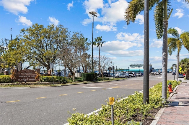 view of street featuring curbs, street lights, and sidewalks