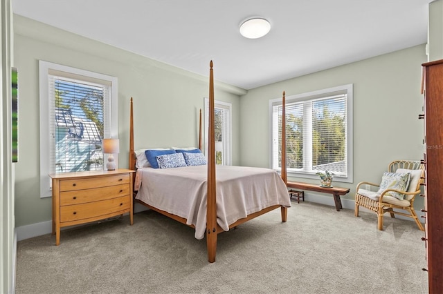 carpeted bedroom with baseboards