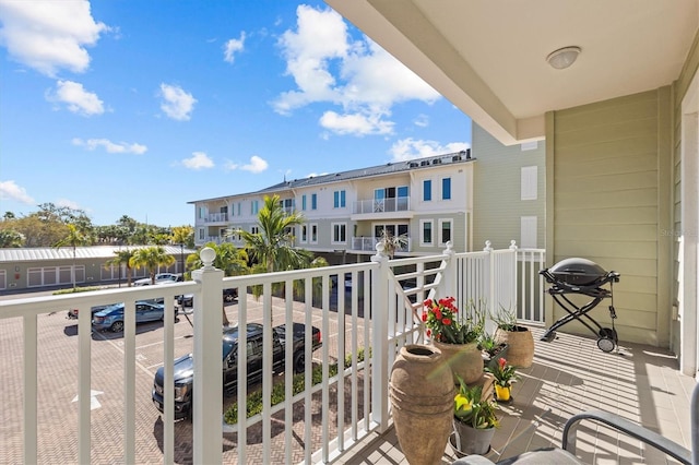 balcony featuring a residential view and a grill