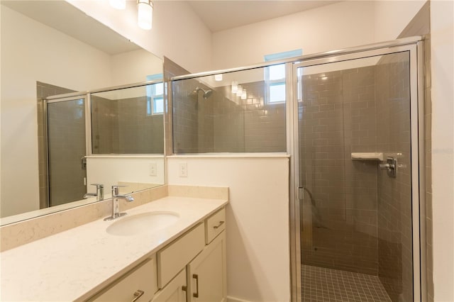 bathroom featuring vanity and a shower stall