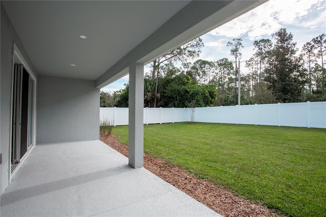 view of yard with a fenced backyard and a patio